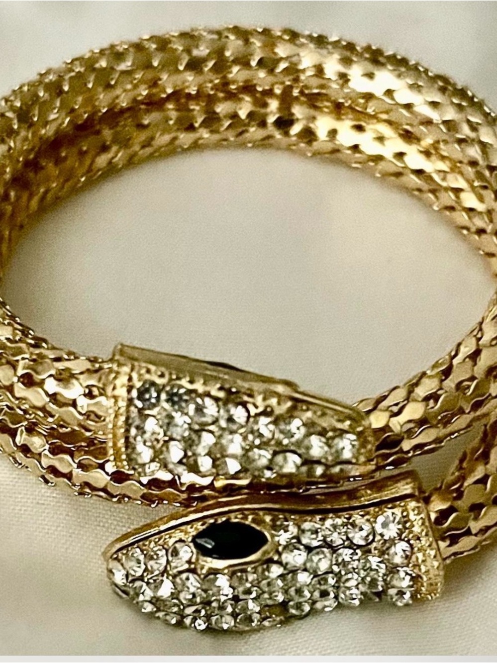 Gold Snake Coil Bracelet with Crystal Accents